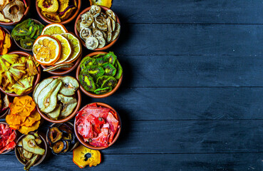 Organic Healthy Assorted Dried Fruit Mix close up. Dried fruit snacks. dried apples, mango, feijoa, dried apricots, prunes top view