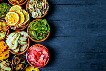 Organic Healthy Assorted Dried Fruit Mix close up. Dried fruit snacks. dried apples, mango, feijoa, dried apricots, prunes top view