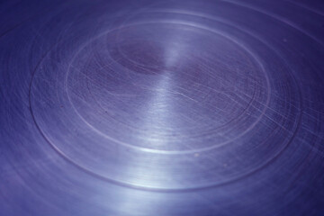 Obraz premium Scratched blue toned round metal surface