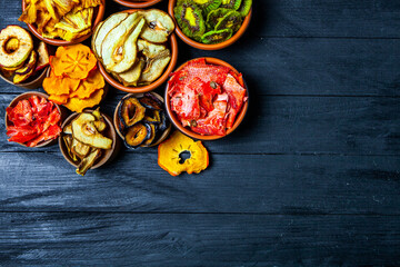 Organic Healthy Assorted Dried Fruit Mix close up. Dried fruit snacks. dried apples, mango, feijoa, dried apricots, prunes top view