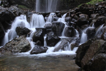 This photo is a photo of the Sibedug river flow with river stones which makes the photo more beautiful. location of Central Java Indonesia.