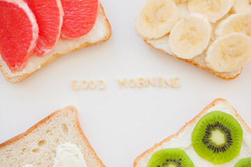 bright mix sandwiches for breakfast fruit, vegetables, fish inscription good morning