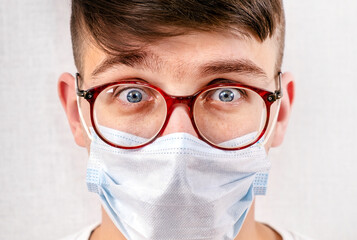 Young Man in Flu Mask