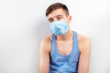 Sad Young Man in Flu Mask