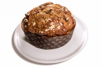 Panettone - Italian Christmas cake from Milan, prepared to celebrate Christmas and New Year, on plate, isolated on white