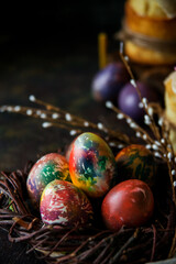 Traditional Orthodox Easter composition with candles, eggs and cake