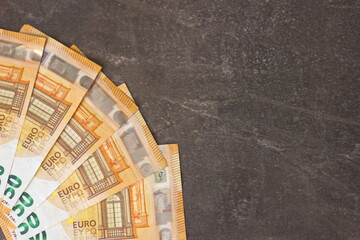 paper money European currency euro on dark background, copy space for text