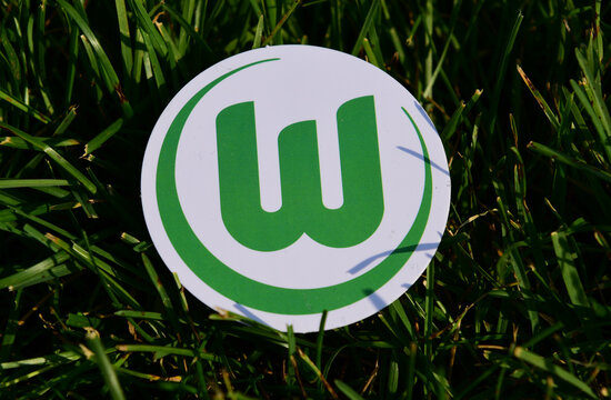 September 6, 2019 Istanbul, Turkey. The emblem of the German football club VfL Wolfsburg on the green grass of the football field.