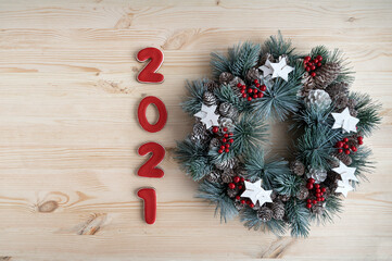 Inscription 2021 on wooden background. Christmas background. Christmas decor