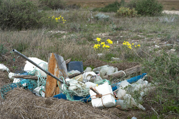 Garbage spilled in a natural setting. Empty dirty plastic bottles. Environmental pollution. Ecological problem.