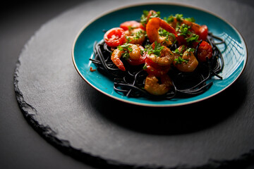delicious fried shrimp with black spaghetti noodles