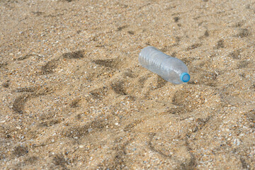 Garbage spilled in a natural setting. Empty dirty plastic bottles. Environmental pollution. Ecological problem.