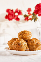 Homemade muffins with ginger and nuts on white table. Healthy eating, gluten free.Homemade tasty dessert or breakfast for Valentine's day,Mother's day