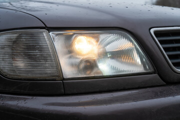 Close-up of the car's fog lights. Headlights in the car, close-up. Close-up of white car headlights. Passing beam. Right headlight