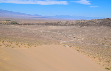 Fototapeta na wymiar Widest view from above. Singing dune (Sand dune) in the Altyn Emel Nationalpark, Kazakhstan