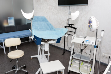 Modern european medical cabinet interior. Gynecological room with chair and equipment