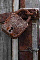 old rusty padlock on the door