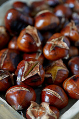 chestnuts on dark wooden surface