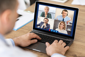 Businessman Talking With Distant Colleagues Via Video Call In Office