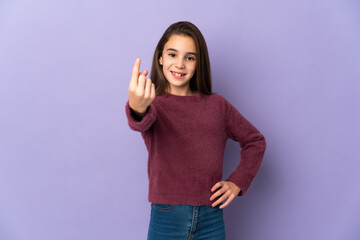 Little girl isolated on purple background doing coming gesture