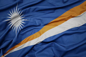 waving colorful national flag of Marshall Islands .