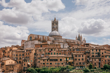 Fototapeta premium Panoramic view of Siena city with historic buildings and street