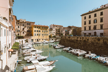 Fototapeta na wymiar Panoramic view of historic buildings of Lovorno with water canal