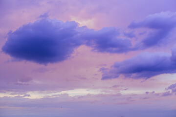 Obraz premium Purple violet sky sunset, dusk clouds in pastel colors in the evening sky