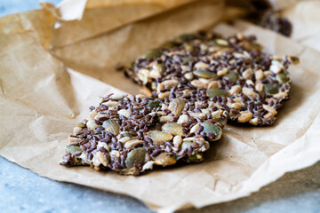 Turkish Homemade Cracker Snacks Biscuit with Sunflower Seeds, Sesame and Dill. Crispy Yaprak Galeta in Craft Paper.