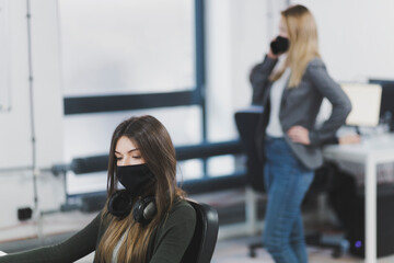 Office workers wearing protective masks