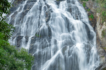 Fototapeta na wymiar Khlong Lan Waterfall, Beautiful waterfalls in klong Lan national park of Thailand. Khlong Lan Waterfall, KamphaengPhet Province - Thailand.