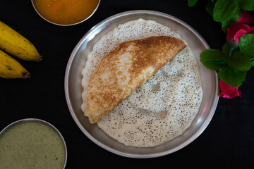 Homemade delicious set dosa in a plate on a dark background