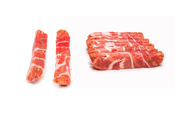 Chevapchichi in bacon isolated on white background.