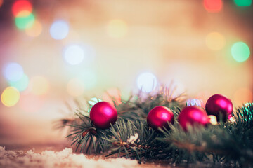 Closeup .Christmas balls and fir-tree branches on wooden backgro