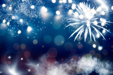 Fototapeta na wymiar Holiday background with fireworks and magic lights