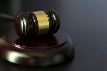 Close-up of Judge's gavel on black table