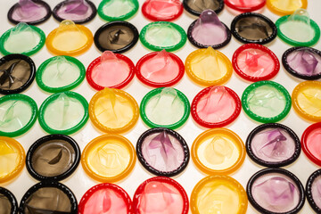Colorful condoms background.