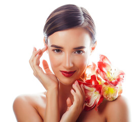 young pretty brunette real woman with red flower amaryllis close up isolated on white background. Fancy fashion makeup, bright lipstick, creative Ombre manicured nails