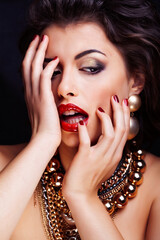 beauty rich brunette woman with a lot of jewellery, hispanic curly lady posing very emotional