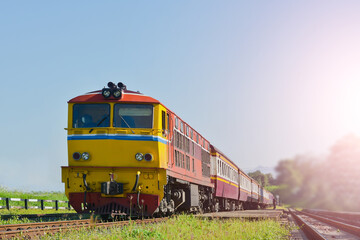 Front of Train yellow and orange Diesel electric locomotive on the tracks of thailand