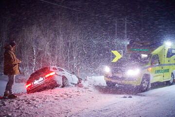 car accident on slippery winter road at night