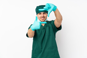 Surgeon in green uniform isolated on isolated white background focusing face. Framing symbol