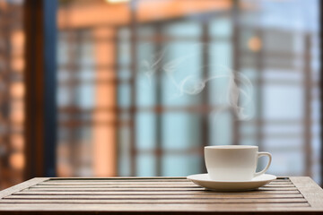Close up coffee espresso on wood table nature background in garden,