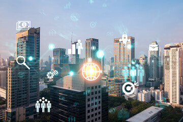 Hologram of Research and Development glowing icons. Sunset panoramic city view of Bangkok. Concept of innovative technologies to create new services and products in Asia. Double exposure.