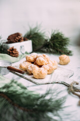 Profiteroles with custard on the table. New Year's dessert