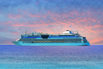 Cruise ship, large luxury white cruise ship liner sailing on blue sea water and twilight sky background.