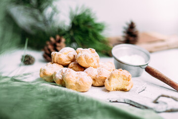 Profiteroles with custard on the table. New Year's dessert