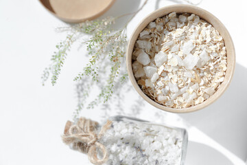Cardboard jar with oatmeal and sea salt. Spa products for cleansing the skin and for a relaxing...