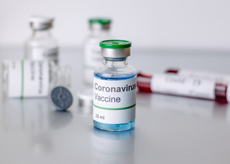  coronavirus covid-19 vaccine in vaccine bottle, doctor in the laboratory with a biological tube for analysis and sampling of Covid-19 infectious ,covid concept