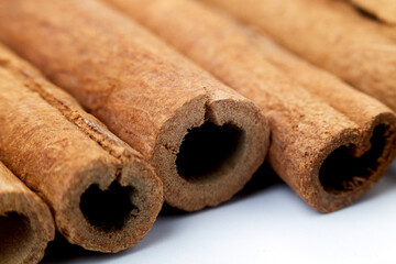 Cinnamon close up on a white background